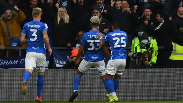 Lyle Taylor celebrates