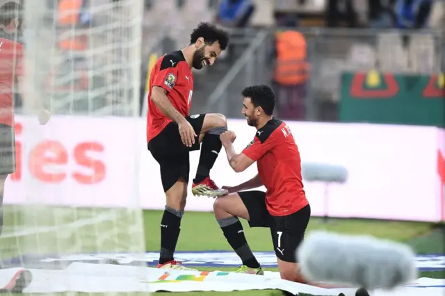 Trezeguet shines Mo Salah's boot after the Liverpool forward set up the Aston Villa player top score