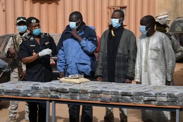 Seized cocaine is seen on a table at the premises of the Central Office for the Repression of Illicit Drug Trafficking (Octris) in Niamey on January 5, 2022.