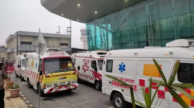 Ambulances lined up outside Amritsar airport to take the infected passengers away