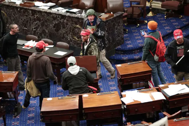 Pro-Trump rioters on the Senate floor