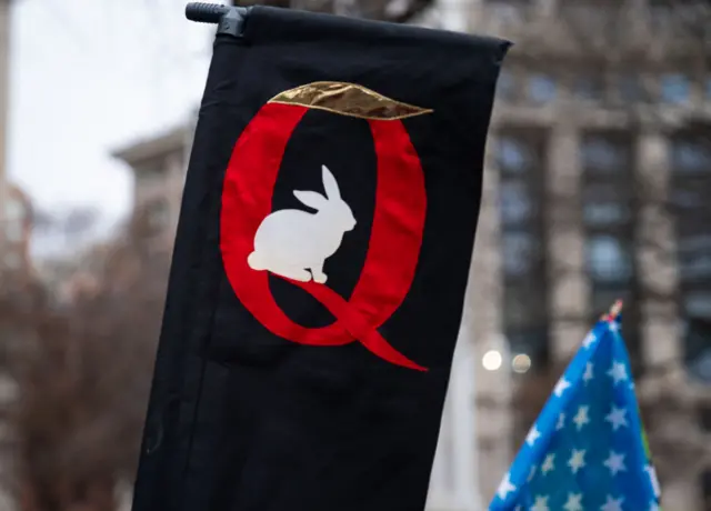 A Q-Anon sign is seen as President Donald Trump supporters hold a rally on 5 January 2021 in Washington, DC