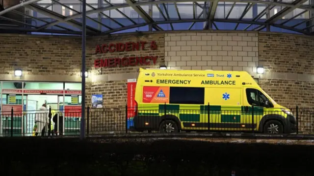 An emergency ambulance arrives at Bradford Royal Infirmary hospital in Bradford, northern England