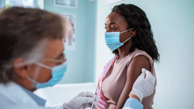 Woman being vaccinated