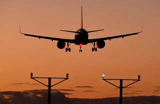 A passenger aircraft prepares to land at Heathrow