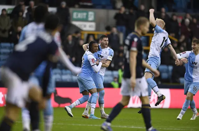 Michael Olise celebrates his goal