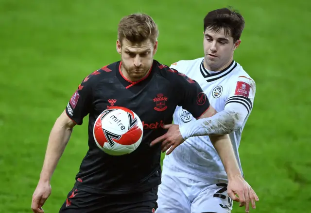 Southampton's Stuart Armstrong (left) and Swansea City's Liam Walsh battle for the ball