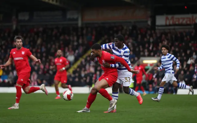 Kidderminster Harriers' Alex Penny (left) and Reading's Mamadi Camara battle for the ball