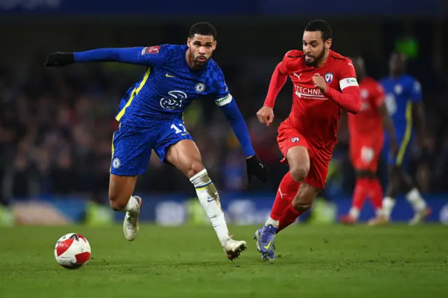 Ruben Loftus-Cheek of Chelsea battles for possession with Curtis Weston of Chesterfield