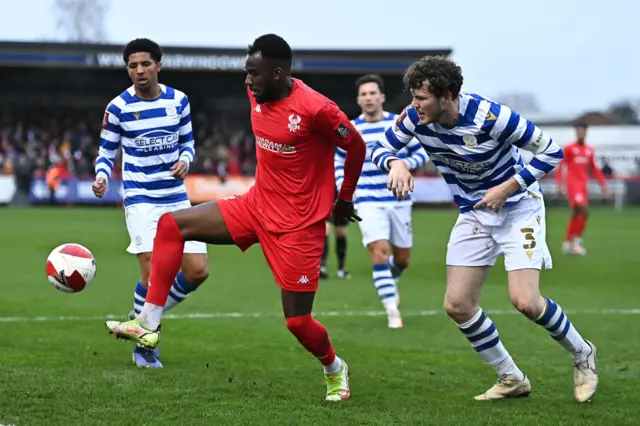 Amari Morgan Smith of Kidderminster Harriers battles for possession with Tom Holmes of Reading