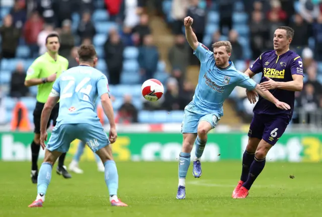 Coventry City's Jamie Allen (centre) and Derby County's Phil Jagielka