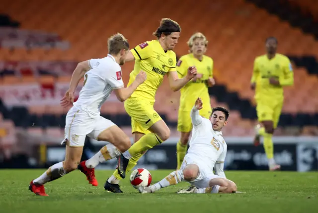 Brentford's Mads Bech Sorensen in action with Port Vale's Thomas Pett