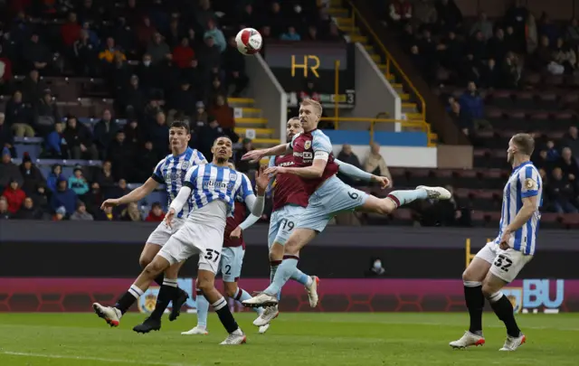 Huddersfield Town's Jonathan Russell in action with Burnley's Ben Mee