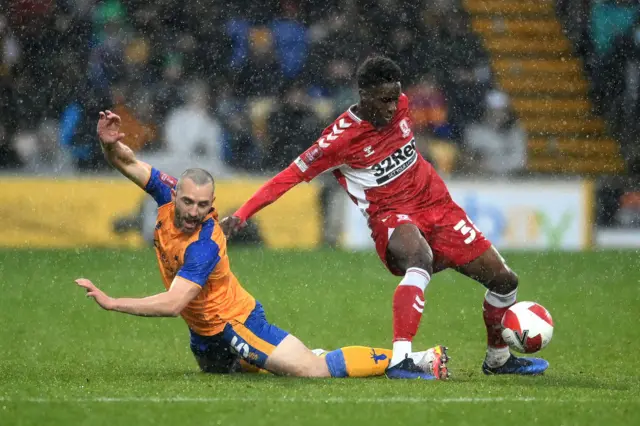 Williams Kokolo of Middlesborough is tackled by John-Joe O’Toole of Mansfield Town