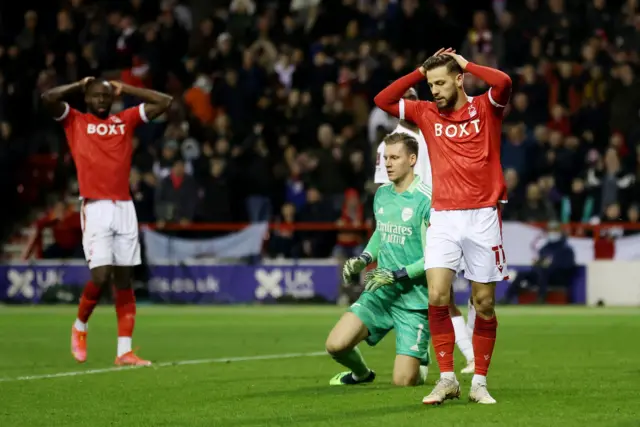 Philip Zinckernagel has his head in his hands after his shot is saved by Bernd Leno