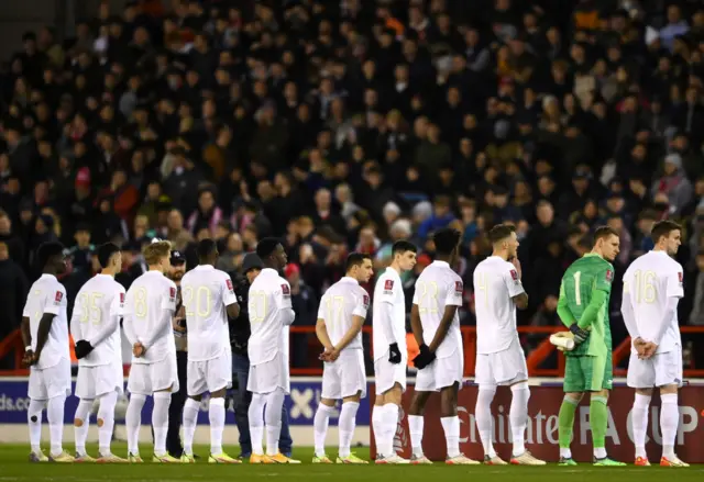 Arsenal lining up in their white kit