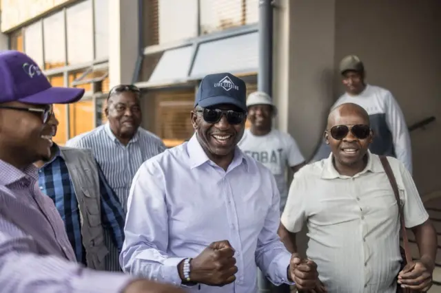 Sam Matekane (C) reacts with supporters as he meets them in Maseru, on October 8, 2022