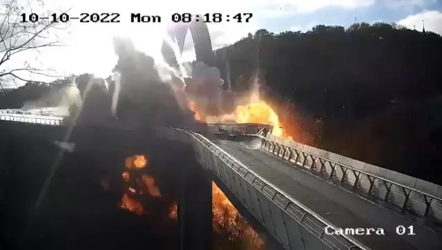 A screen grab taken from a surveillance camera shows an explosion rocked a bridge in the Shevchenkivskyi district of the Ukrainian capital, Kyiv on October 10, 2022.