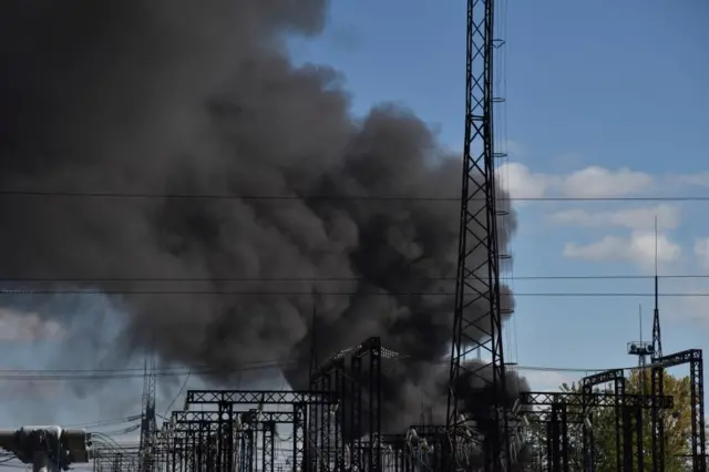 Smoke over a power lines in Lviv after a Russian missile strike on Monday
