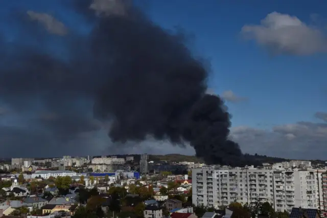 Smoke rises over the city of Lviv after missile strikes on Monday