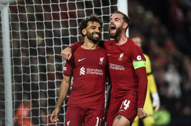 Mo Salah (left) celebrates with Jordan Henderson after making it 2-0