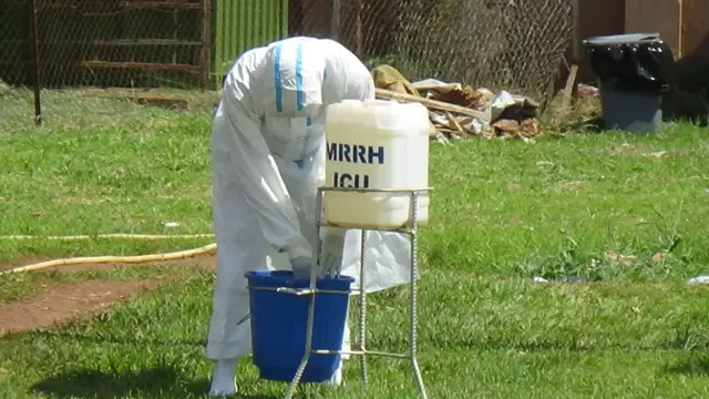 A healthworker at Mubende Regional Referral Hospital after an outbreak of Ebola