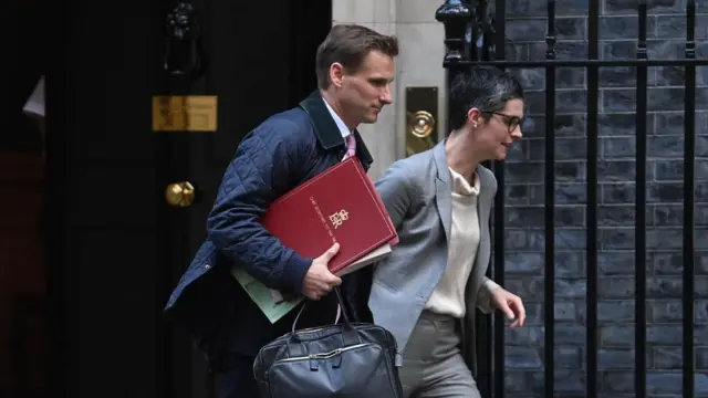 Chief Secretary to the Treasury and Work Chris Philp (L) and Pensions Secretary Chloe Smith (R) leaves after attending the weekly Cabinet meeting at 10 Downing Street, in London, Britain, 11 October 2022.