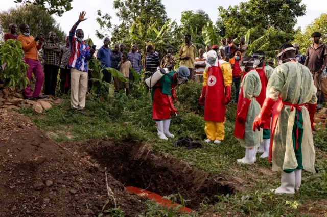 A prayer is read during a Safe and Dignified Burial of an Ebola victim on October 11, 2022 in Mubende, Uganda