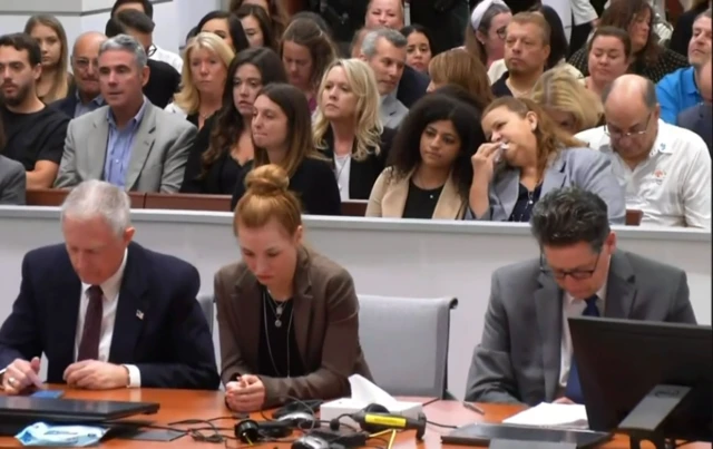 Families of victims sit in the court room as they await for the verdict to be read.