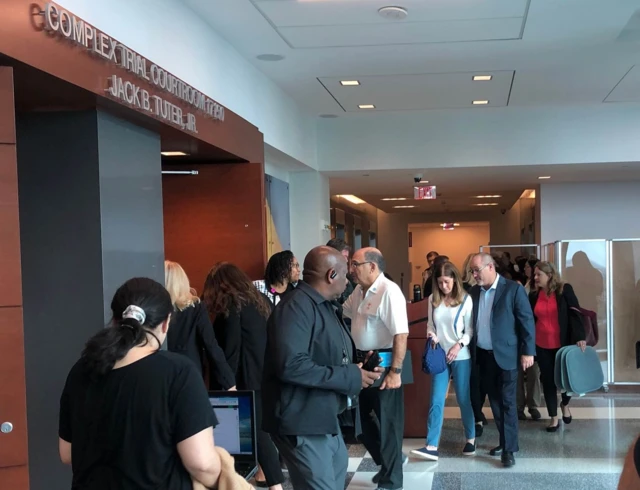 Victims’ families file into the courthouse to hear the verdict