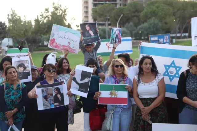 Mandatory Credit: Photo by ABIR SULTAN/EPA-EFE/REX/Shutterstock (13443766g) Israelis take part in a solidarity protest with Iranian woman Mahsa Amini, in Jerusalem, 06 October 2022. Amini, a 22-year-old Iranian woman, was arrested in Tehran on 13 September 2022 by the morality police, a unit responsible for enforcing Iran's strict dress code for women. She fell into a coma while in police custody and was declared dead on 16 September 2022. Solidarity with Mahsa Amini in Jerusalem, Israel - 06 Oct 2022