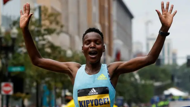 Diana Kipyokei of Kenya crosses the finish line to win the women's division of the 125th Boston Marathon