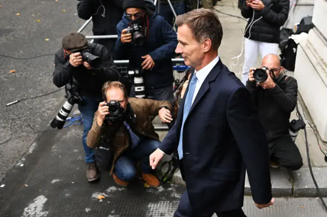 Jeremy Hunt walks past photographers on Friday