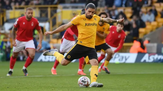 Ruben Neves scores from the penalty spot.