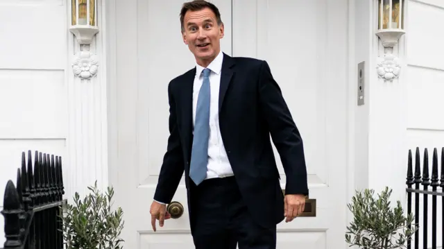 Jeremy Hunt leaves his home in London yesterday after being made chancellor