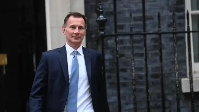 Britain's newly-appointed chancellor, Jeremy Hunt, leaves 10 Downing Street