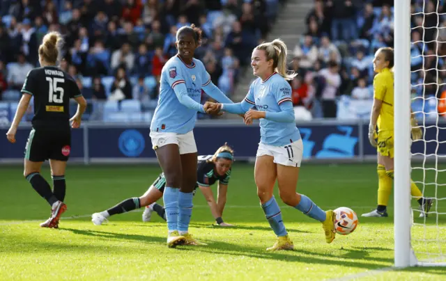 Lauren Hemp celebrating her goal.