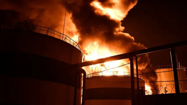 Sunflower oil tankers on fire with smoke plumes billowing above them