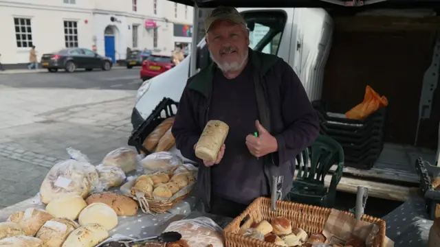 Michael VanKan holding a loaf of bread