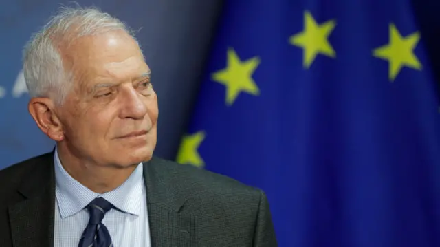 EU foreign policy chief Josep Borrell in front of the European Union flag