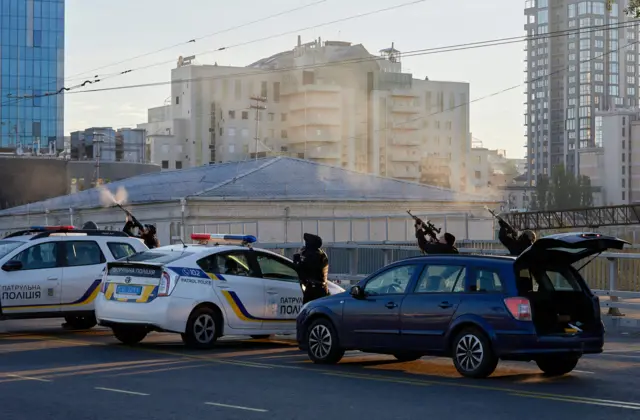 Ukrainian police shooting at a drone in Kyiv