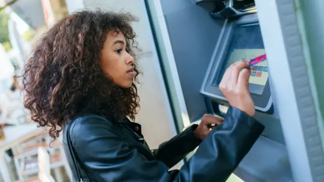 Woman using an ATM