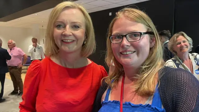 Liz Truss next to Conservative Party member Mackenzie Vaughan