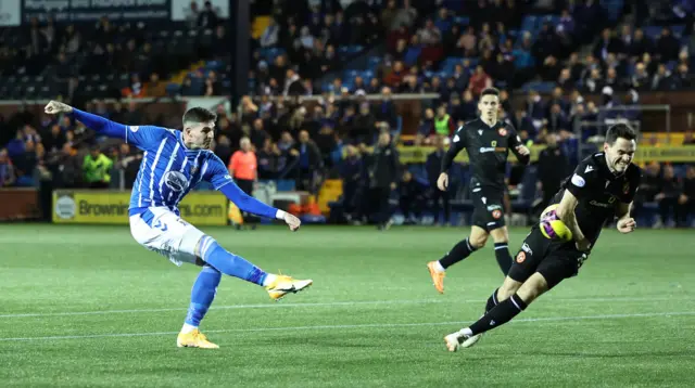 A snapshot of the penalty decision as Kyle Lafferty's shot hits Liam Smith