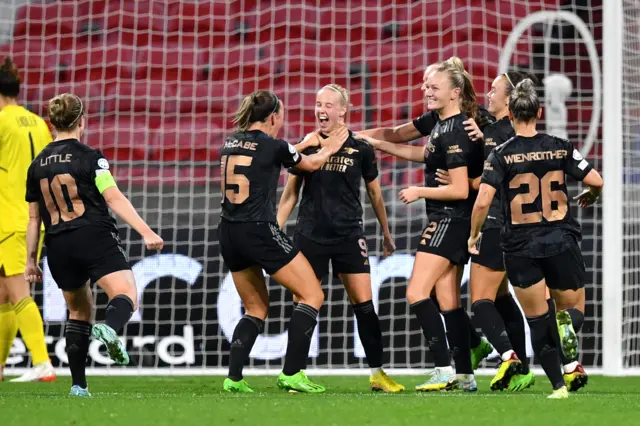 Beth Mead and Arsenal celebrate a goal against Lyon in the Women's Champions League