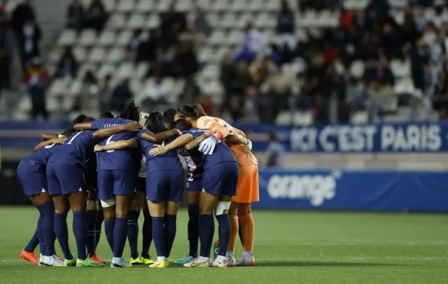 PSG team form a huddle