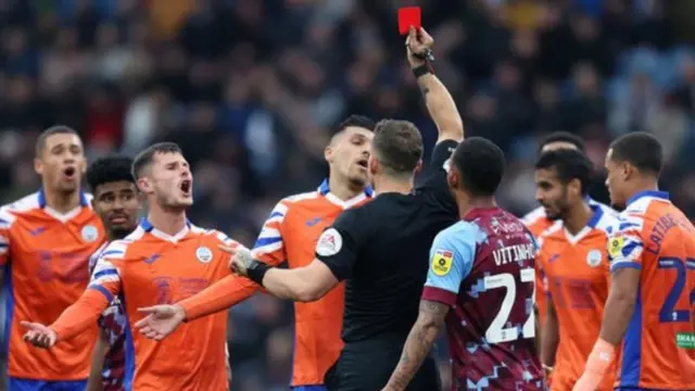 Joel Piroe reaction photo as he is shown a red card at Turf Moor