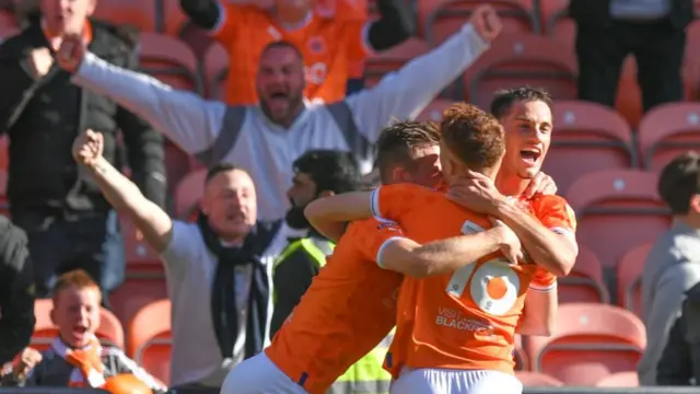 Blackpool celebrate scoring in their 4-2 home win over Preston North End yesterday