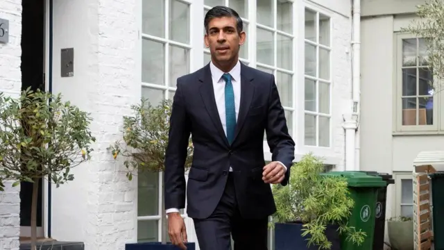 Rishi Sunak outside his London home