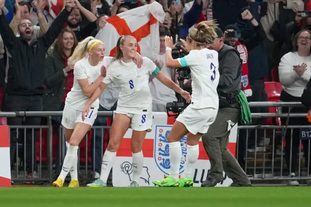 Georgia Stamway celebrates scoring against USA